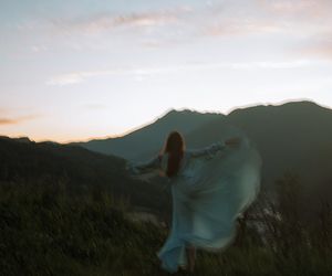 Blurred silhouette of a person in a graceful motion.